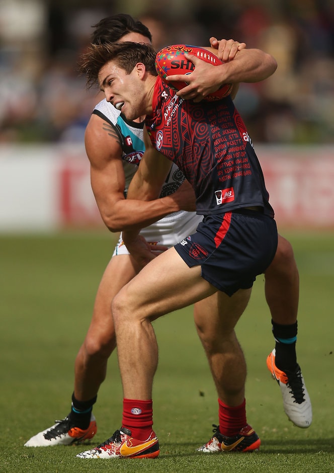 AFL 2016 Rd 10 - Melbourne v Port Adelaide ALICE SPRINGS, AUSTRALIA - MAY 28: Jack Viney of the Demons is tackled by Chad Wingard of the Power during the 2016 AFL Round 10 match between the Melbourne Demons and Port Adelaide Power at TIO Traeger Park on May 28, 2016 in Alice Springs, Australia. (Photo by Sean Garnsworthy/AFL Media)